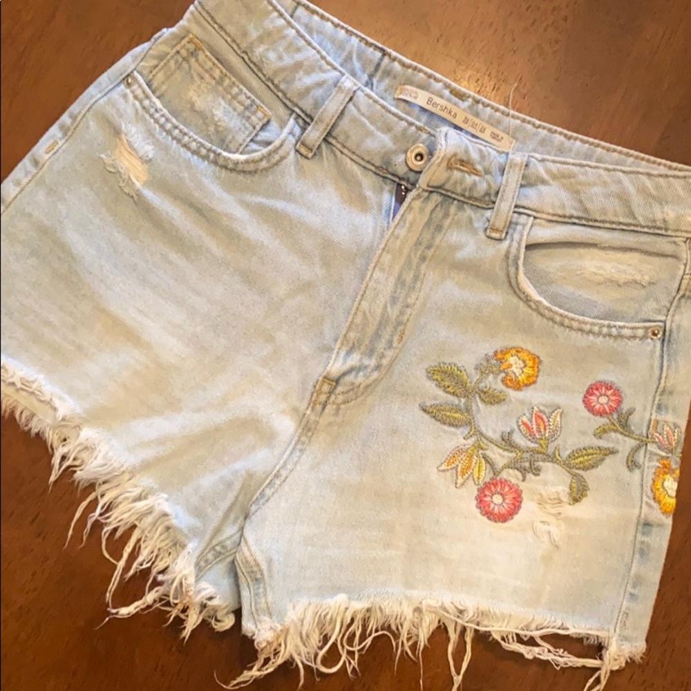 Light blue distressed denim shorts